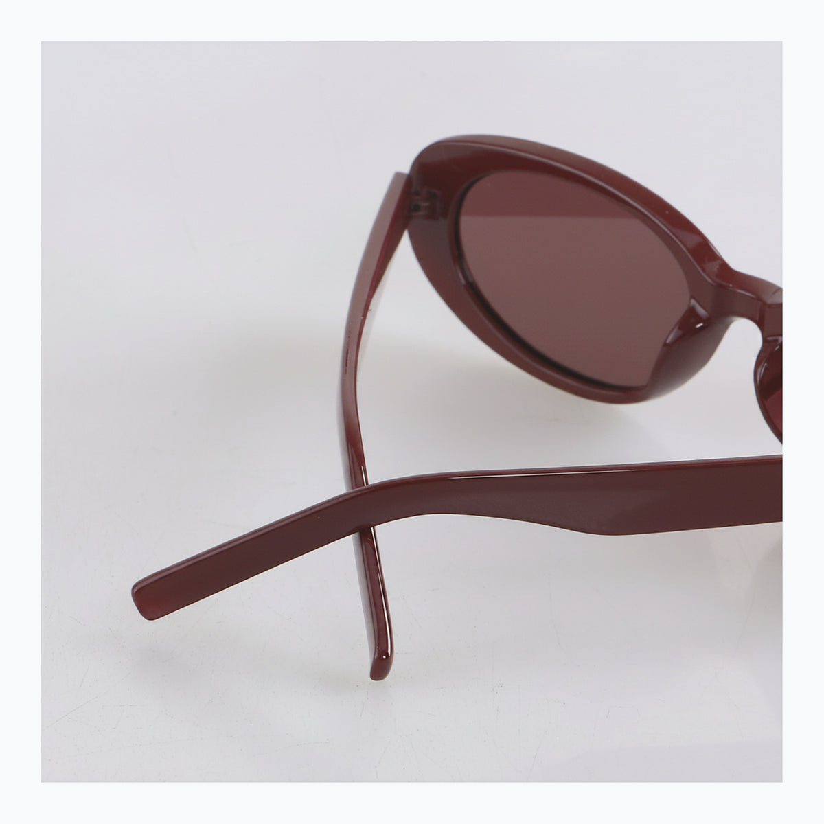 Jaxy Scarlet Oval sunglasses — back-crossed view #Color_Burgundy