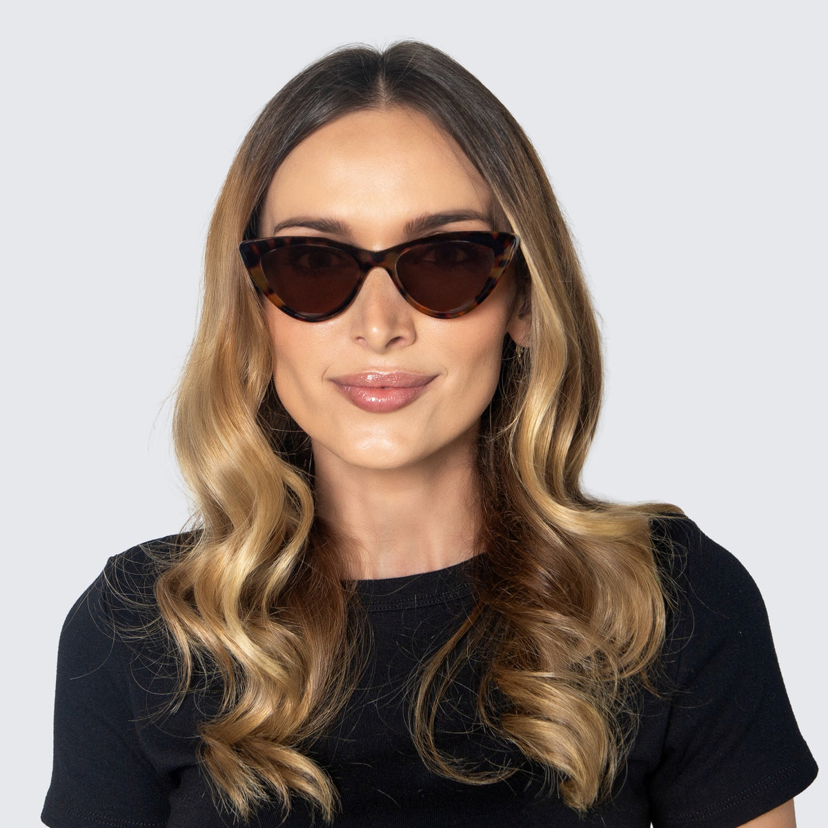 Jaxy Vamp Cat-eye sunglasses — worn view #Color_Tortoise