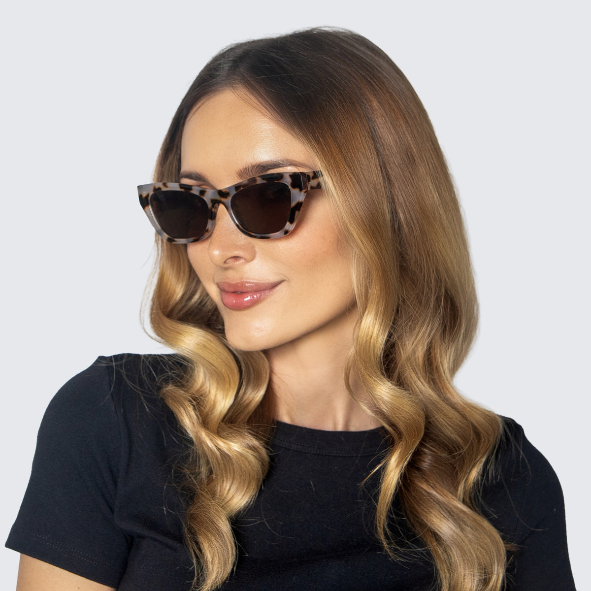 Jaxy Spritz Cat-eye sunglasses — worn view #Color_Tortoise