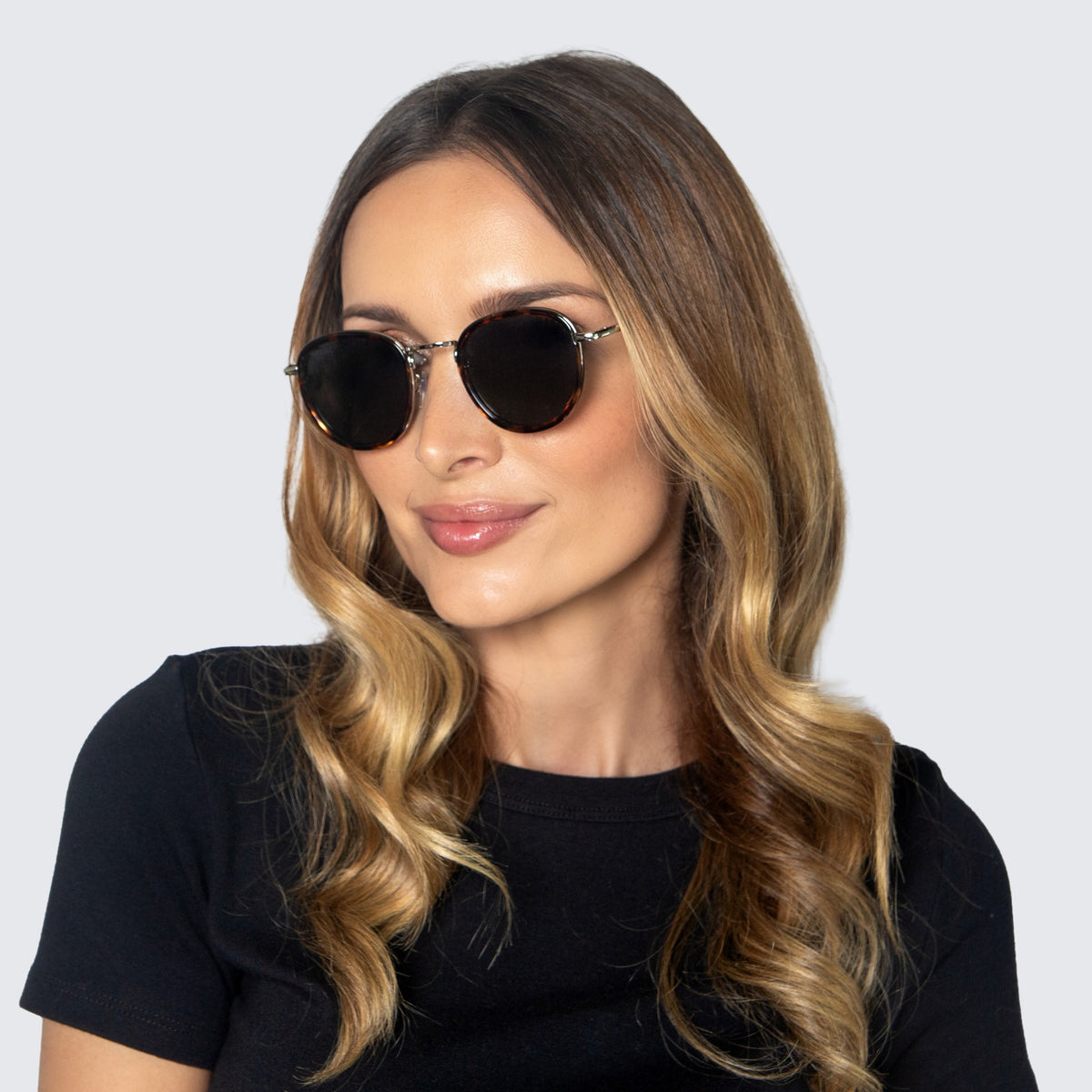 Jaxy Latitude Round sunglasses — worn view #Color_Tortoise