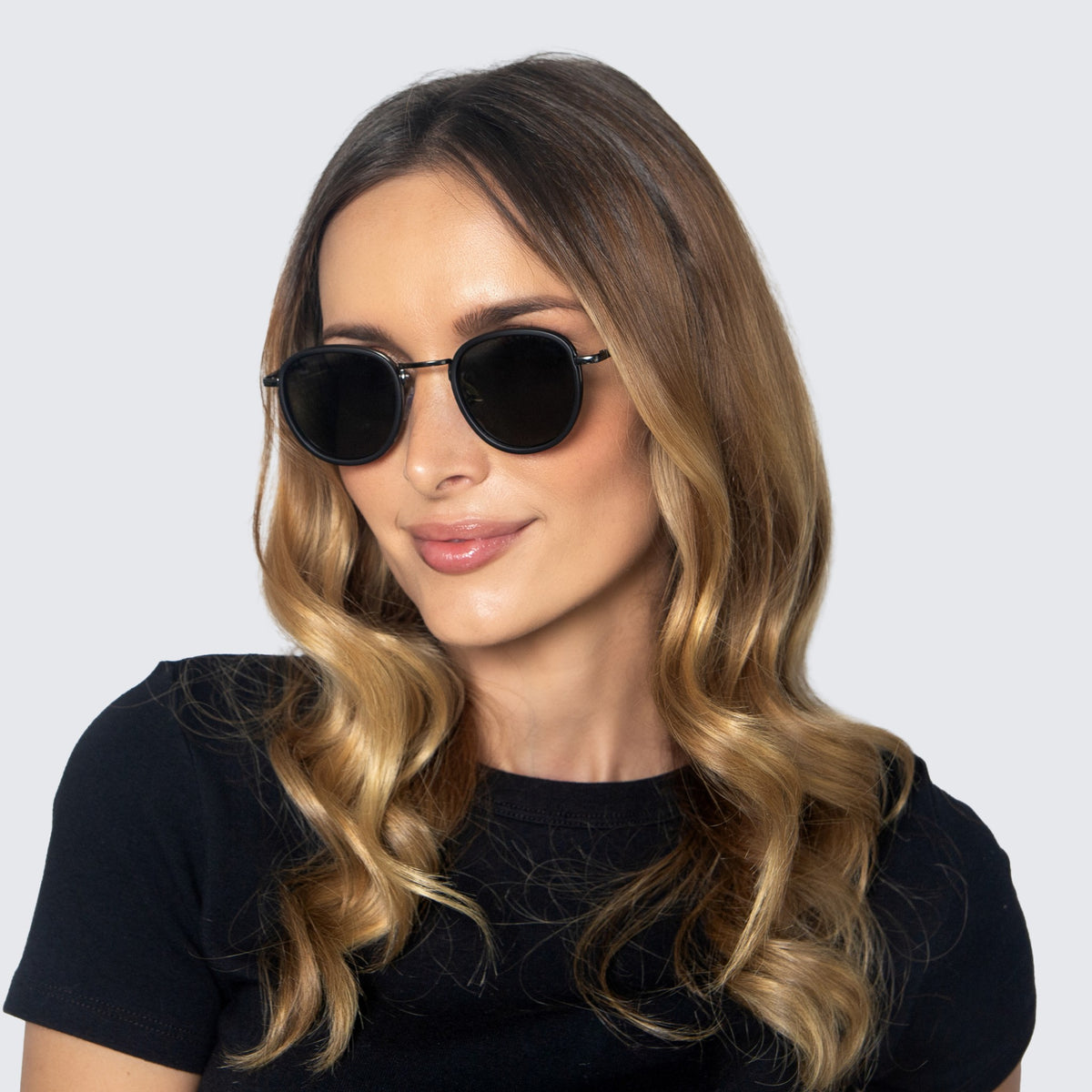 Jaxy Latitude Round sunglasses — worn view #Color_Black