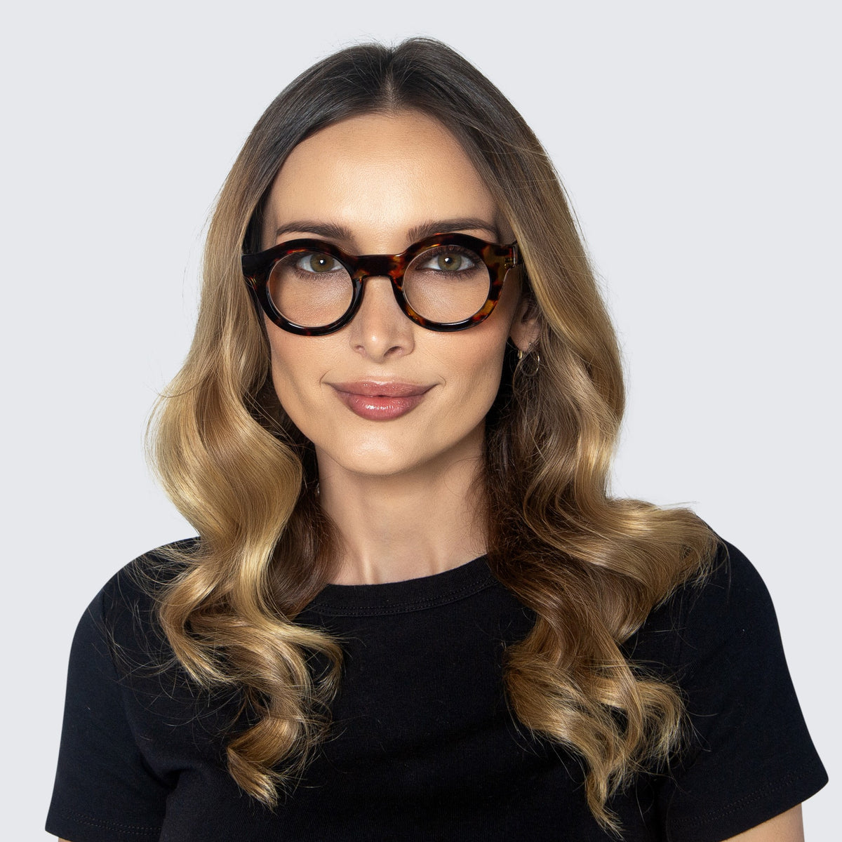 Jaxy Footnote Round sunglasses — worn view #Color_Tortoise