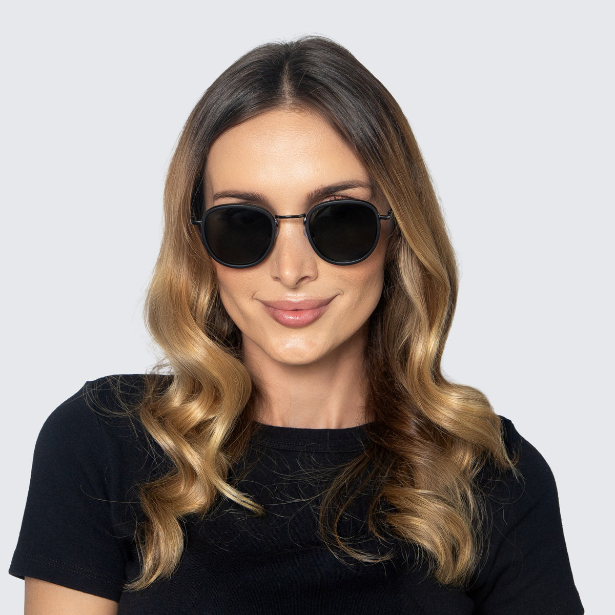 Jaxy Latitude Round sunglasses — worn view #Color_Black