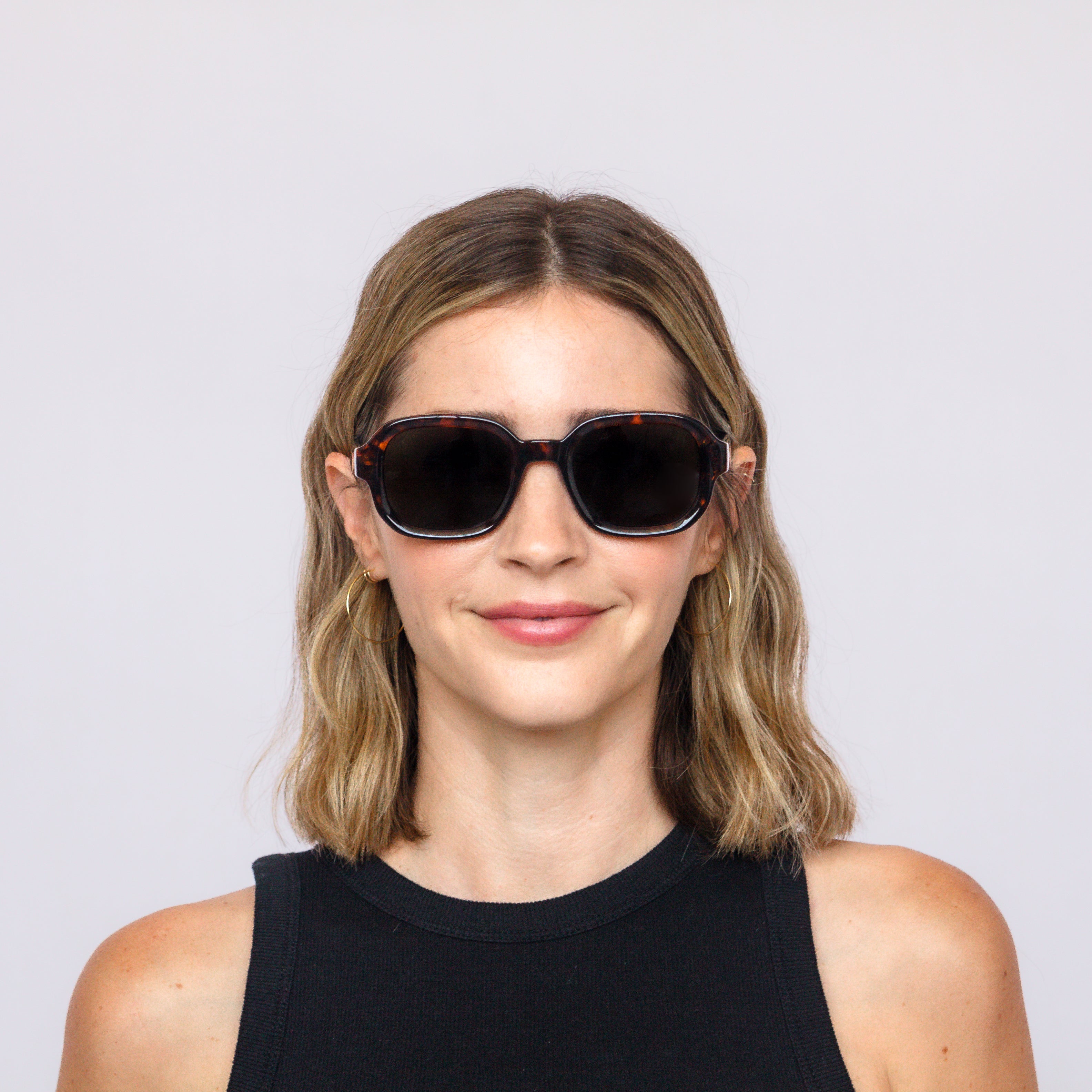 Model wearing Jaxy Boulevard square sunglasses – lifestyle photo