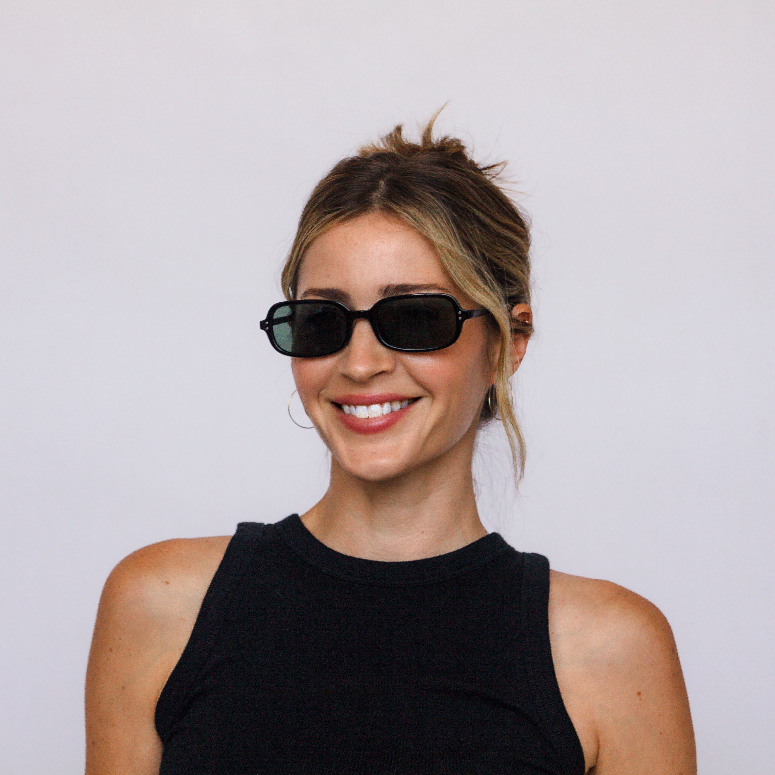 Model wearing Jaxy Palm State square sunglasses – lifestyle photo
