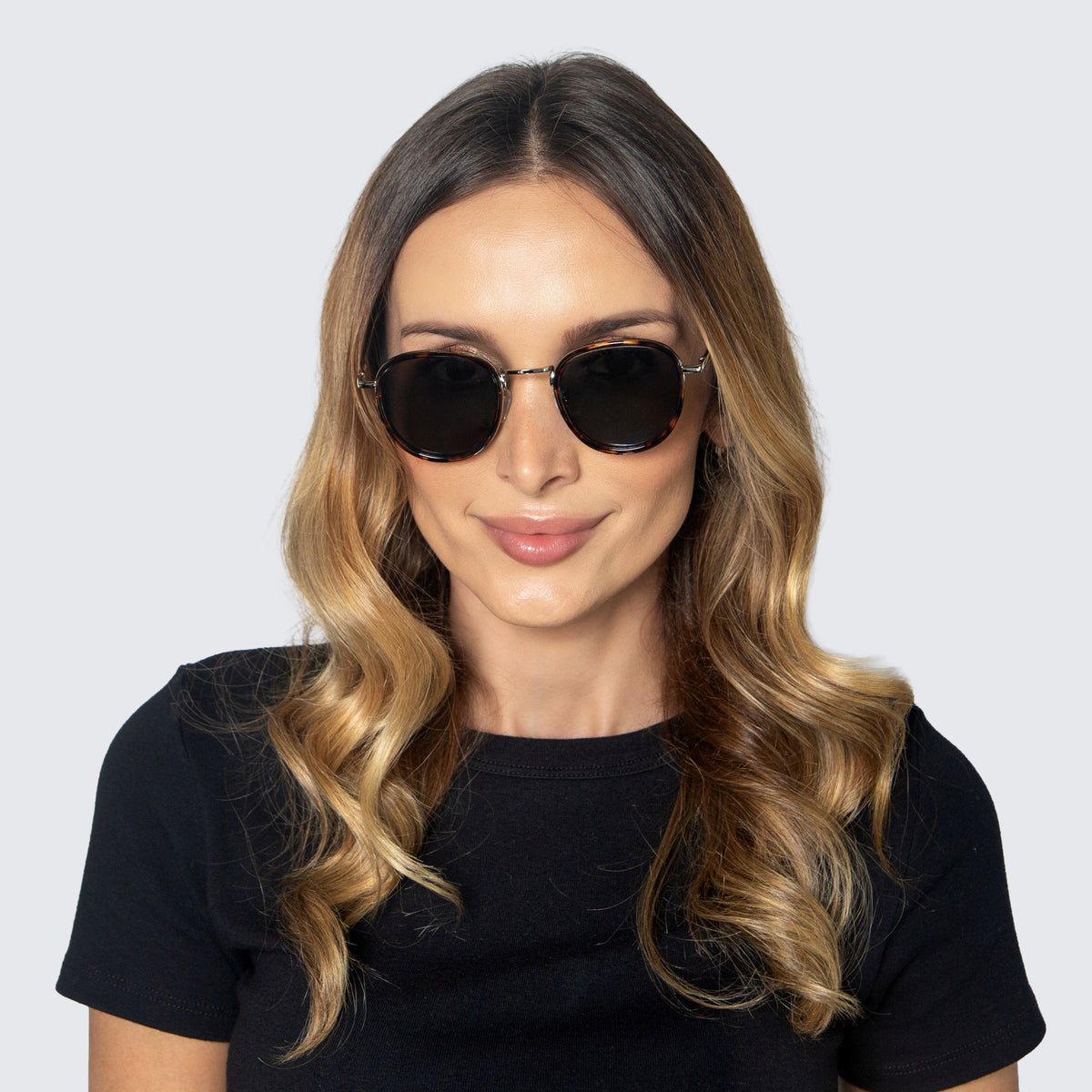 Jaxy Latitude Round sunglasses — worn view #Color_Tortoise